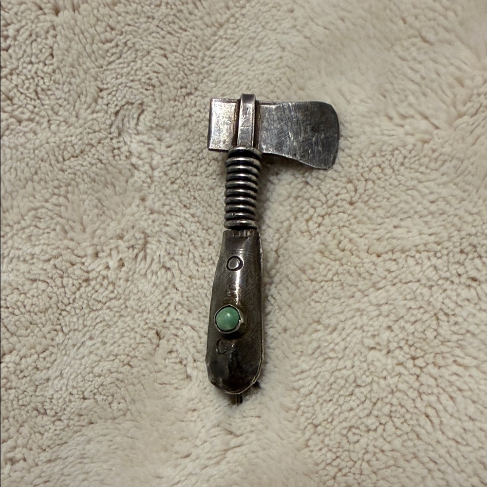 Brooch native American Sterling silver tomahawk with turquoise stone